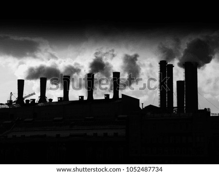 Smoke from factory chimneys silhouette backdrop