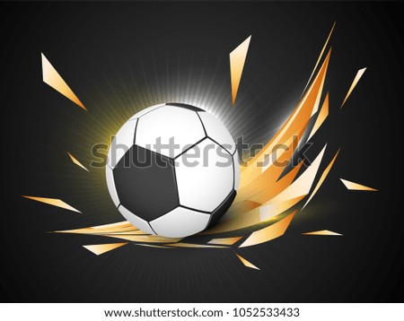 Shiny soccer ball on golden abstract background. 