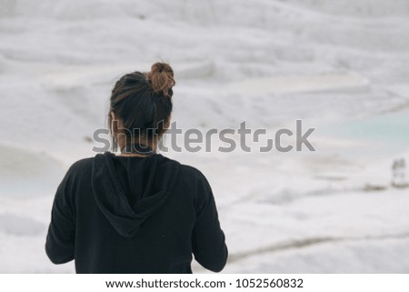 Woman Taking Picture of Natural Travertine Pools and Terraces in Pamukkale, Turkey
