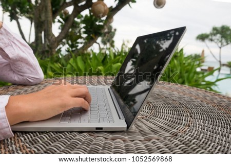 Recreational entrepreneur. Woman with laptop working during vacation in hotel