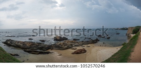 Landscape view on rocky coast ocean in Galle Srilanka in cloudy weather