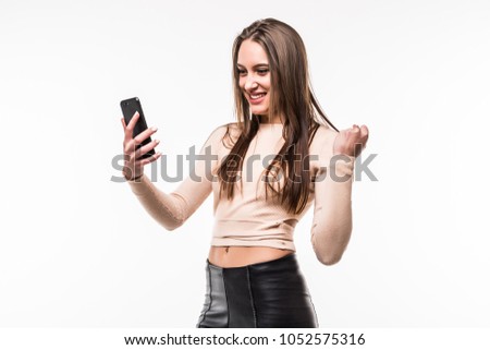 Woman using a mobile phone isolated on a white background