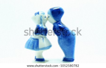 Boy and girl kissing each other by graphic leather pattern style white background                   
