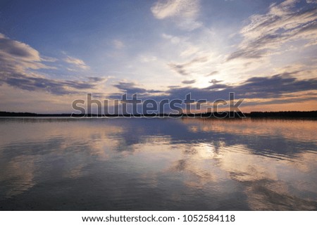 Colorful sky and colorful water in lake reflected in evening
