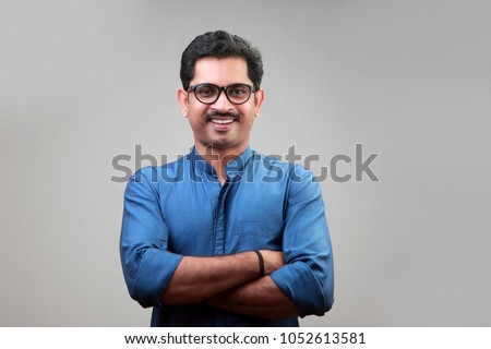 Portrait of a happy smiling young man Royalty-Free Stock Photo #1052613581