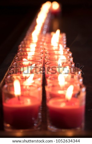 Red candles on black screen