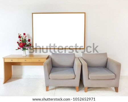 Relaxing corner with comfortable sofas and colorful flowers, Modern concept interior, Blank frame was made for inserting pictures.
