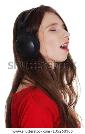 Happy teen girl with headphones, isolated on white