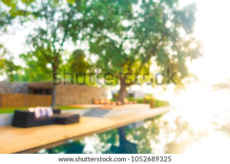 Abstract blur defocused swimming pool in luxury hotel resort for background