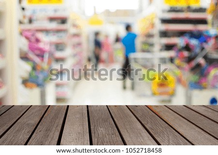 blurred image people in shopping mall with bokeh