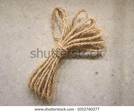 Rope closeup on Plywood texture background.