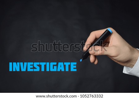 The businessman writes a blue marker inscription:INVESTIGATE