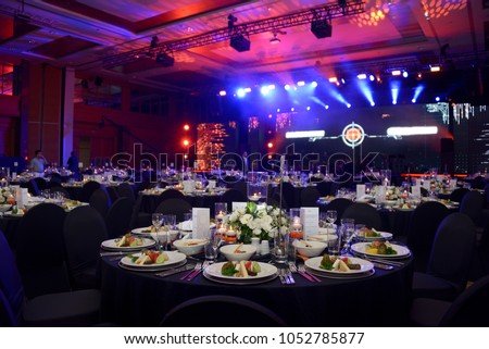 Wedding hall or other function facility set for fine dining Royalty-Free Stock Photo #1052785877