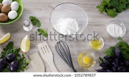 Flour in glass bowl on the restaurant table, cookies recipe, baking ingredients