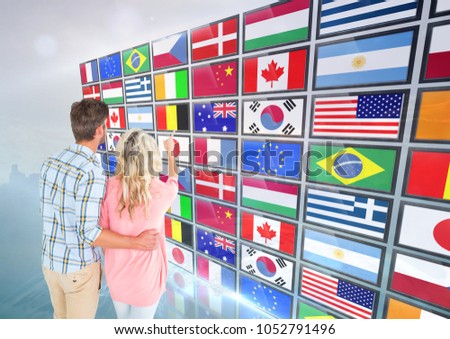 Digital composite of panel with flags, couple fingering one flag