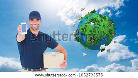 Digital composite of Happy delivery man showing smart phone with low poly globe in background
