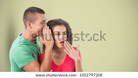 Digital composite of Man whispering in woman's ear over colored background