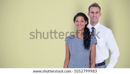 Digital composite of Portrait of confident business colleagues standing against green background