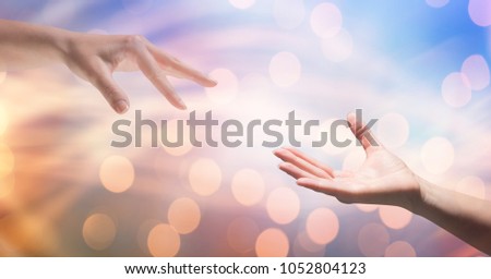 Digital composite of Cropped image of woman reaching man against bokeh