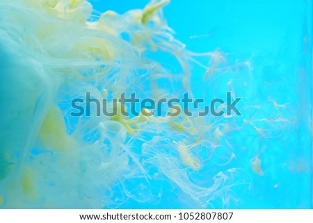 Abstract color clouds on a sky blue background.