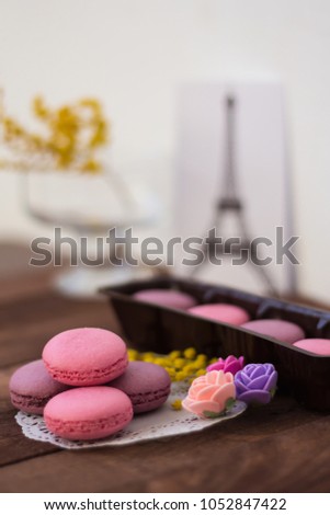 delicate Macarons with a picture of the Eiffel tower as a background blur
