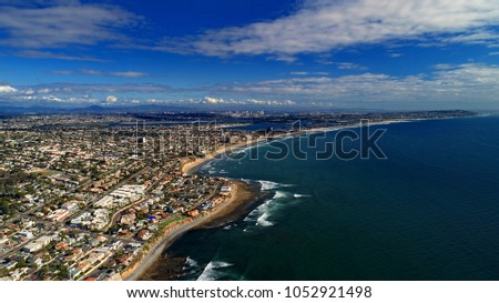 Birds eye view of mission beach, pacific beach, miles of coastline, mission bay, and downtown San Diego in the background