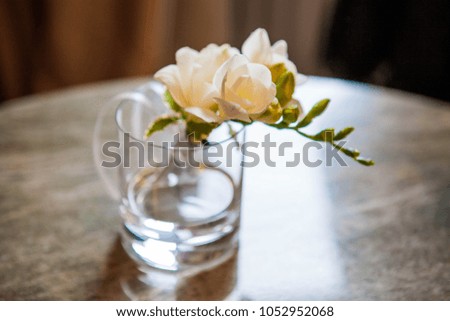 boutonniere of living white flowers