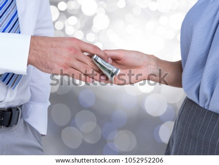 Digital composite of Hands exchanging money business with sparkling light bokeh background