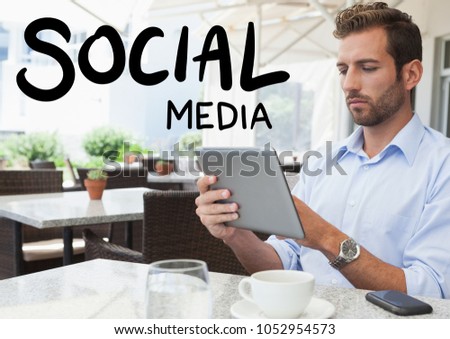 Digital composite of Social media text against man in cafe with tablet