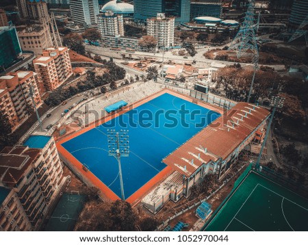 Aerial view of outdoor hockey field. The image contain soft focus, grain and noise.