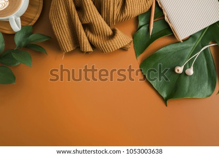 Styled stock photography brown office desk table with blank notebook, keyboard, macaroon, supplies and coffee cup. Top view with copy space. Flat lay.