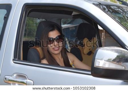 Beautiful girl driving car