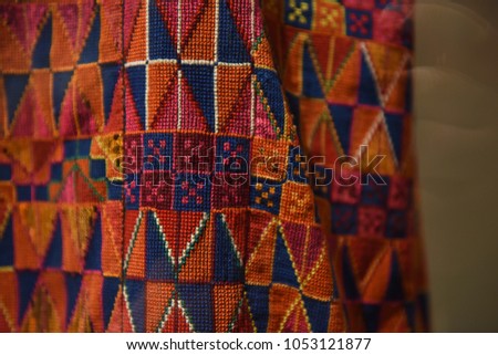Colorful patterns of Palestinian embroidery using  a double cross stitch. Traditional Palestinian dressed were always embroidered, but the colors and patterns varied from one region to another.