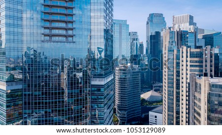 Aerial view of office buildings in Jakarta central business district, IndonesiaAerial view of modern office buildings under blue sky in Jakarta central business district, Indonesia