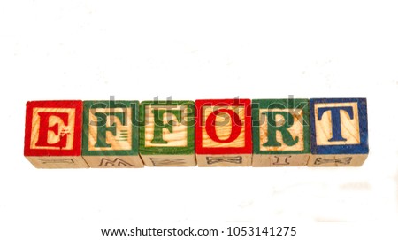 The phrase effort visually displayed on a white background using colorful wooden toy blocks image in landscape format