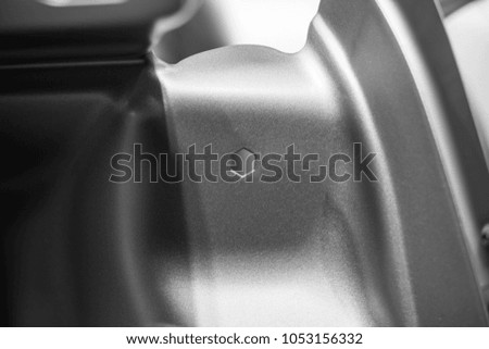 Metal parts of a car in automotive production .