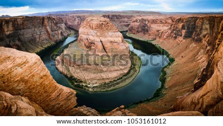A panoramic photo of Horseshoe Bend in Colorado river, Page, AZ, USA.
