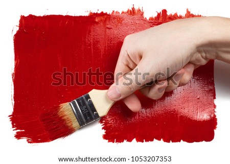 Hand painting using a thick red brush, isolated on white background