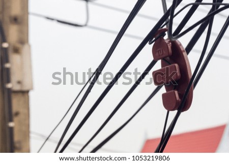 Messy electrical cables , telephone line.