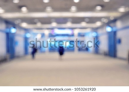 Background blur bright blue tones.
walkway Inside the building there are people.