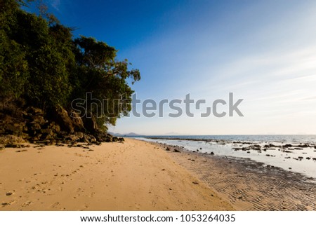 Summer seascape on tropical koh Kradan island  in Thailand. Landscape taken on main long sunrise beach with blue sky, coral reef and white sand.