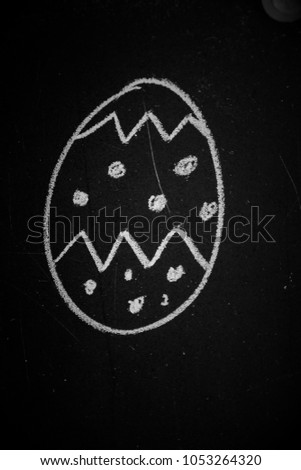 Easter egg on blackboard