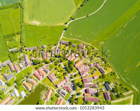 Aerial view of beautiful village in summer countryside. Background texture concept.