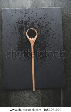 black sesame on wooden spoons
