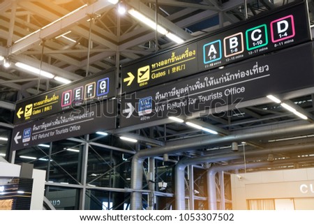 Info sign at Suvarnabhumi International Airport.  Directions for check in, boarding gates, registrations  custom and VAT refund for tourists at terminal connections.