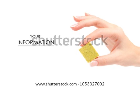 Dry cube of broth female hand pattern on a white background isolation