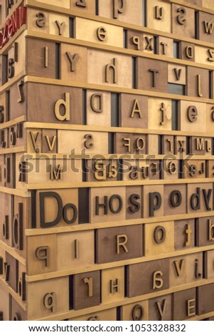 Retro Styled english Alphabet on Wooden Background. toned texture.