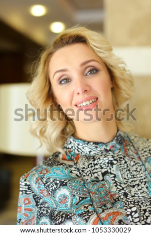 Pretty woman with cute smile, make up and blonde hair. concept of portrait photo.