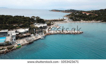 Aerial drone bird's eye photo of famous celebrity sandy beach of Astir or Asteras and Vouliagmeni beach in south Athens riviera with turquoise clear waters, Vouliagmeni, Greece