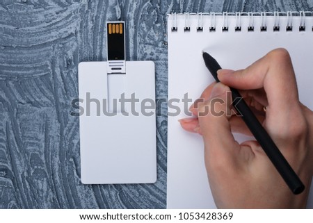 Business card blank, notepad, mobile phone, vallet, smart watch, notebook, mini food basket and pen at office desk table top view. Corporate stationery branding mock-up